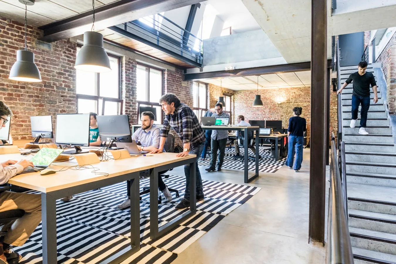 5w pr workplace interior with employees working at desks