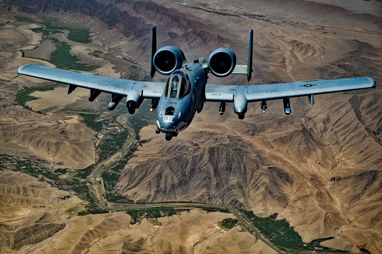 a10 warthog aircraft in flight showing its powerful engines and distinctive shape