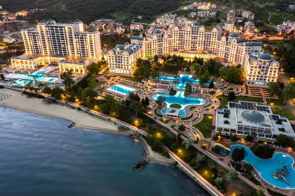 aerial view of a sunny sea resort beach on black