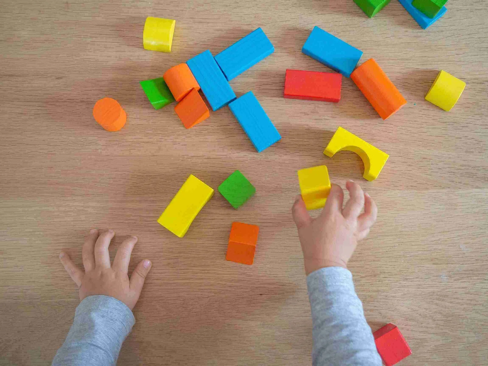 childrens toys on a wooden floor with soft lighting