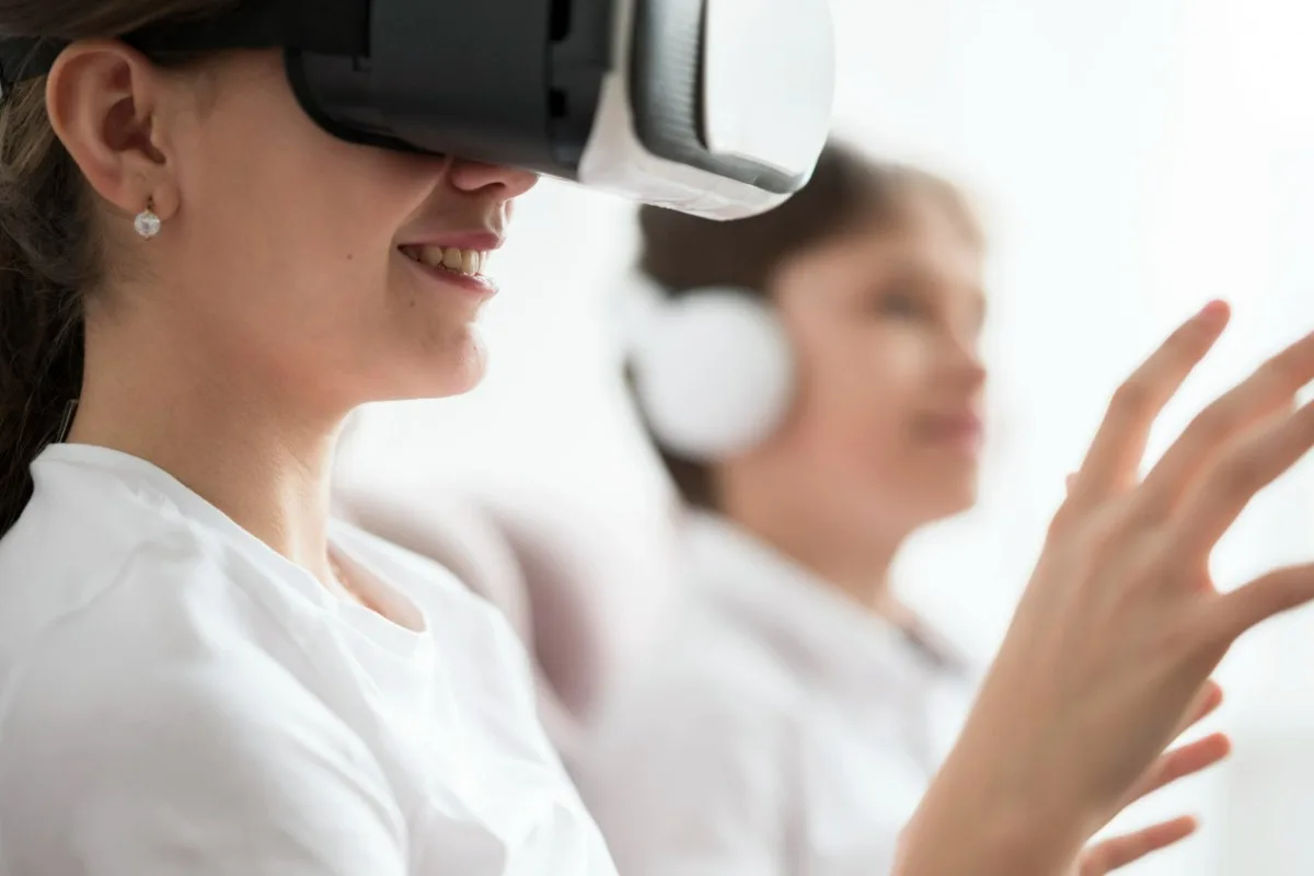 siblings trying a virtual reality headset in a close up shot