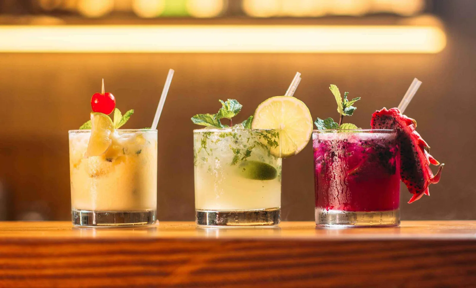 cocktail season drinks with fresh garnishes and ice
