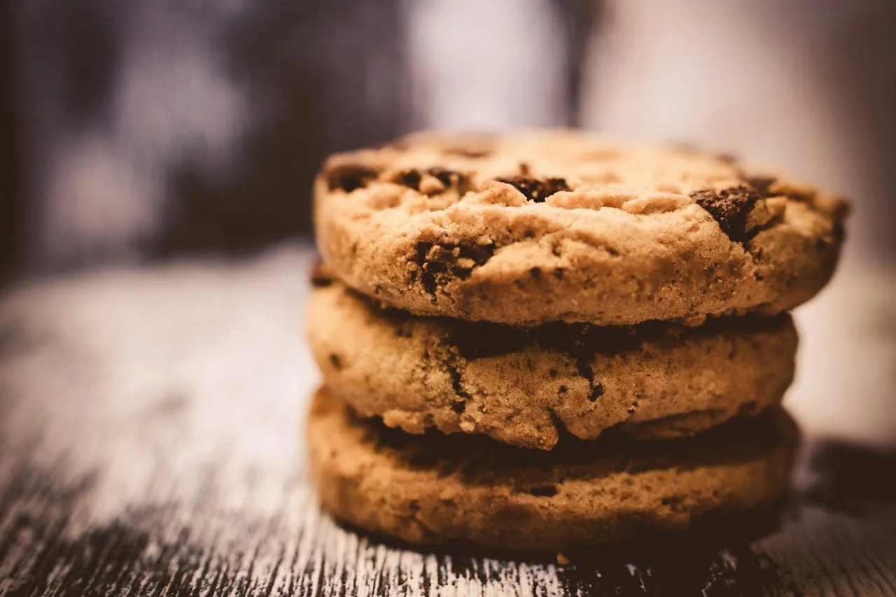 a close up of delicious chocolate chip cookies on a baking sheet