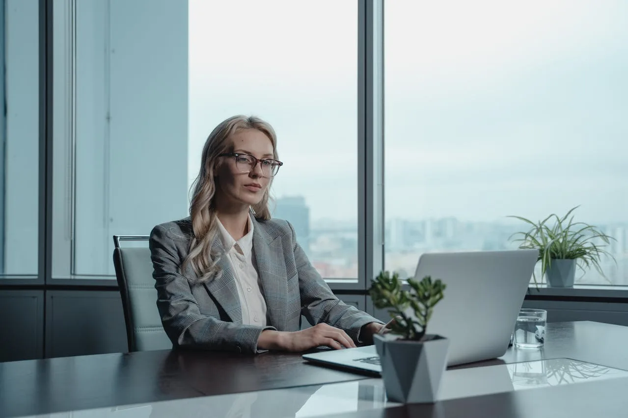 corporate executive in a modern office setting reviewing documents