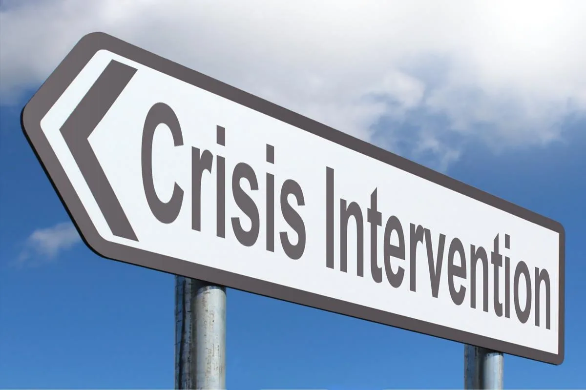 crisis intervention team members working together to help someone