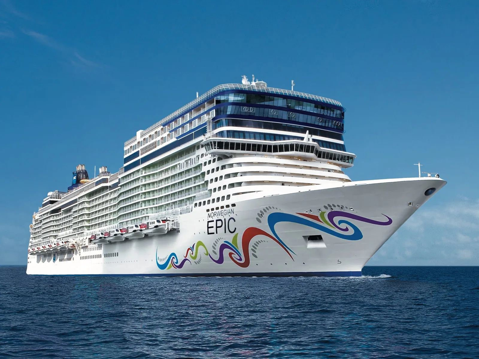 luxury cruise ship sailing on the ocean at sunset