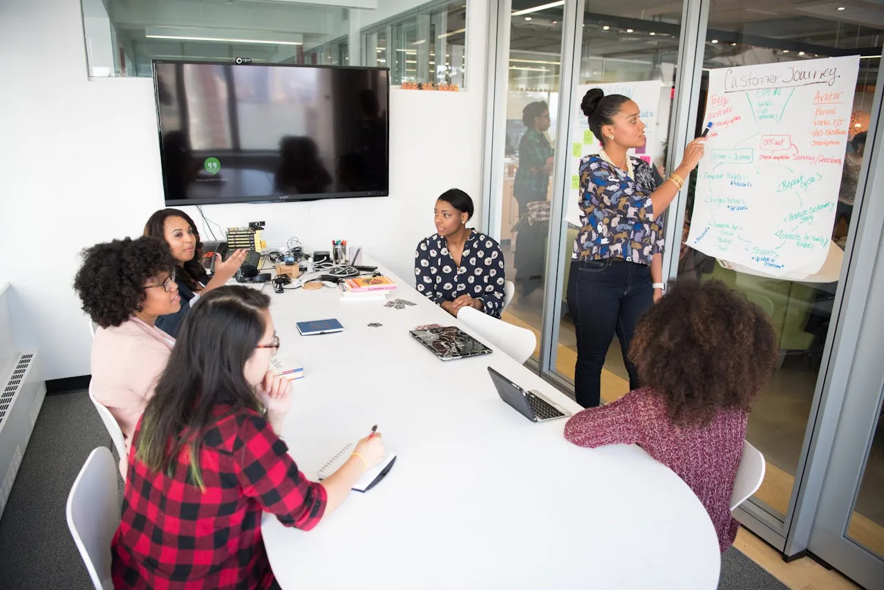 employees gathered in a meeting room for a discussion