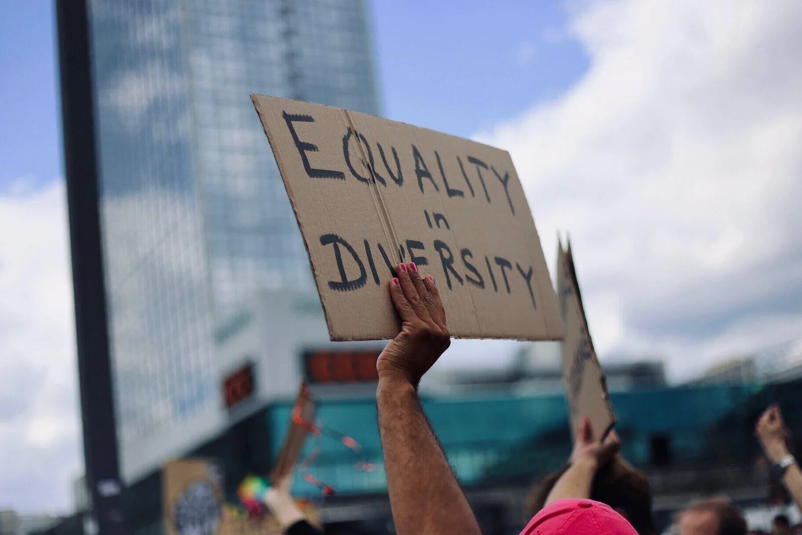 people of different backgrounds standing together in unity and equality