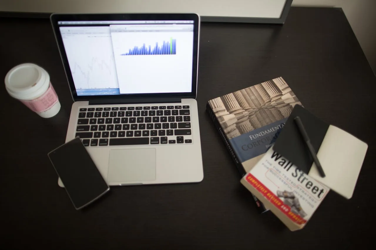 fintech books and graphs showing financial technology trends