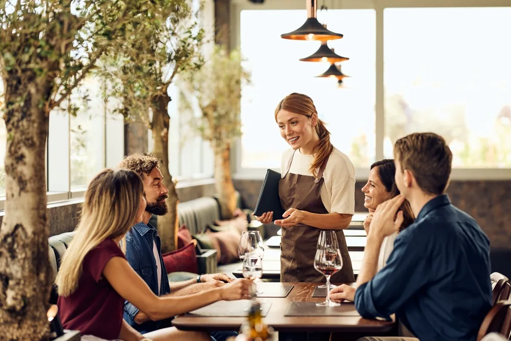 friends enjoying fine dining restaurant experience with attentive service