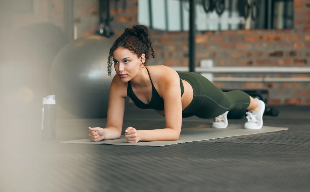 gym workout fitness trainer demonstrating exercise