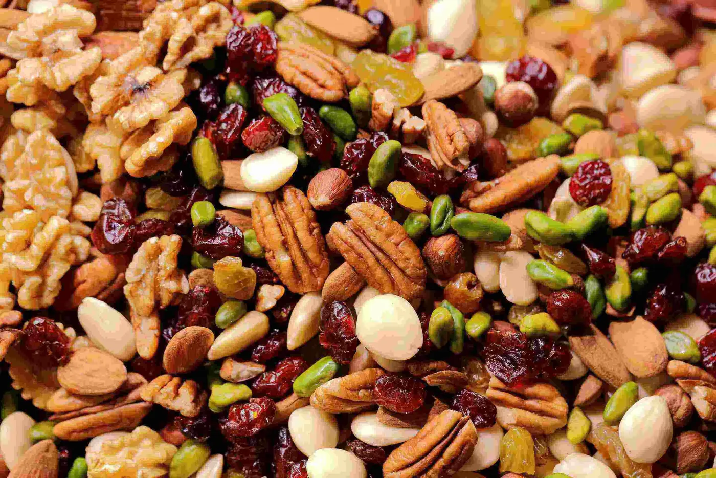 healthy snacks on a wooden table with fruit and nuts