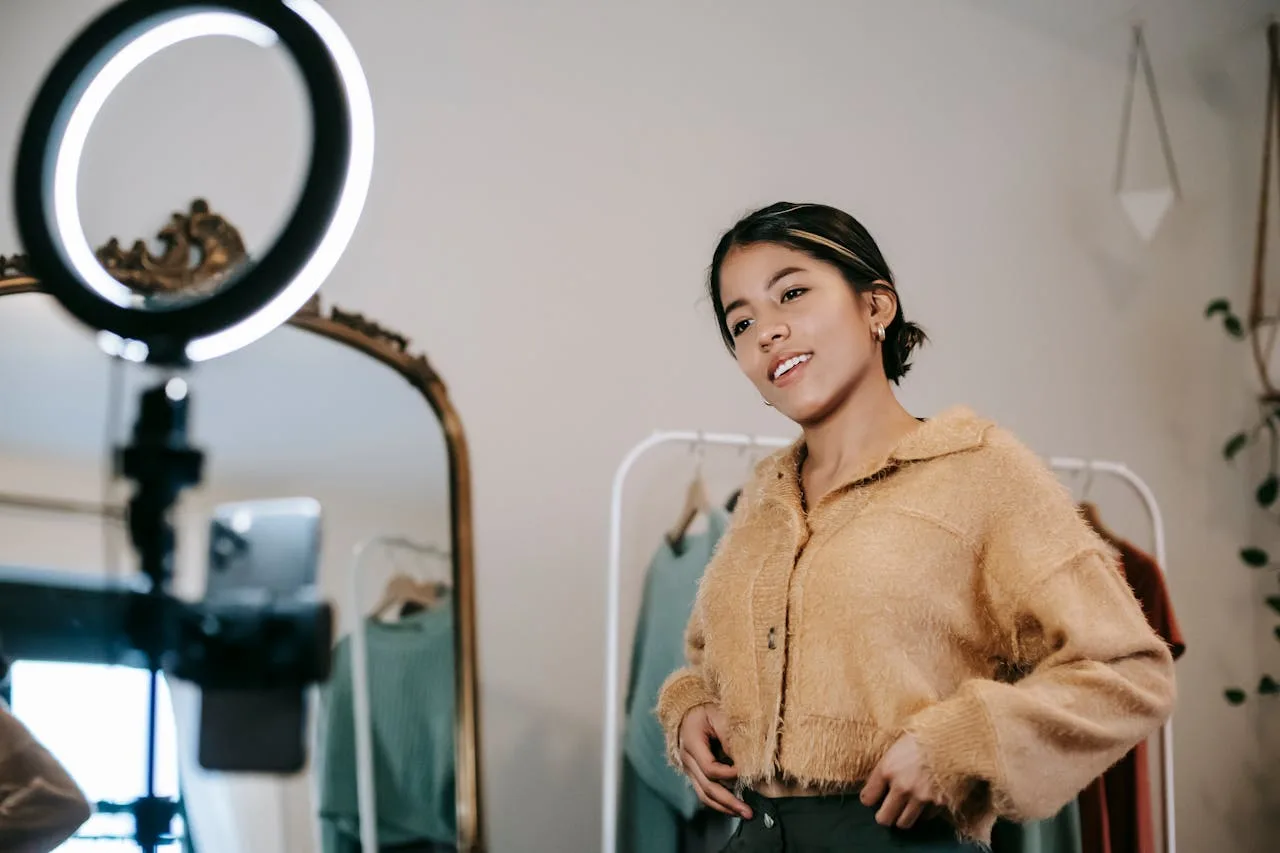 influencer standing in front of bright studio lighting