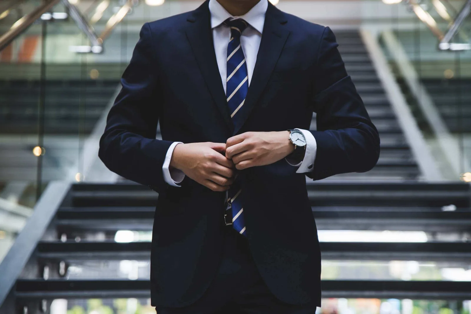 investor in a suit looking at financial charts