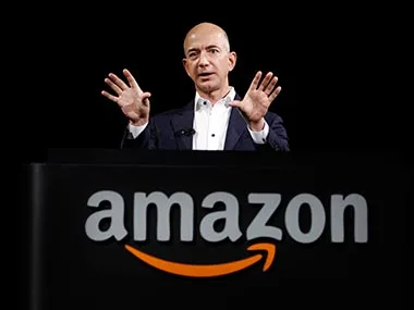 jeff bezos founder of amazon in a blue shirt