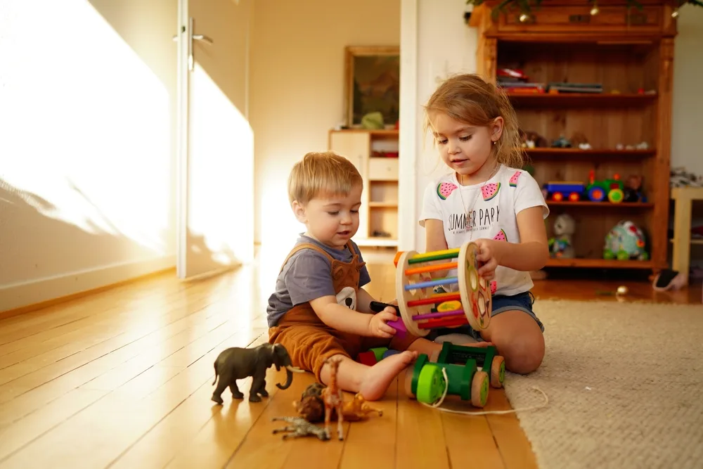 children happily playing with a variety of colorful toys