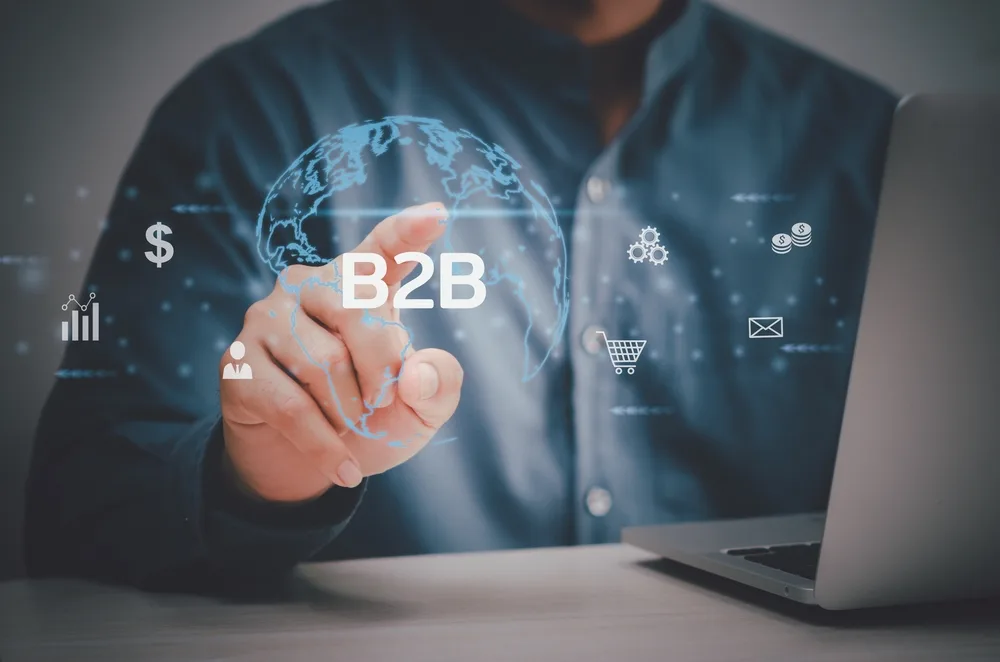 man using laptop with virtual screen for b2b business