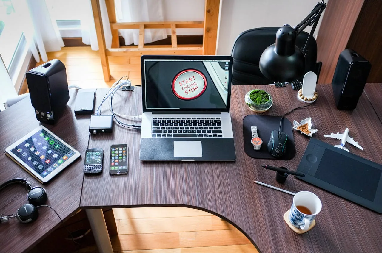 marketing desk workspace with computer and office supplies