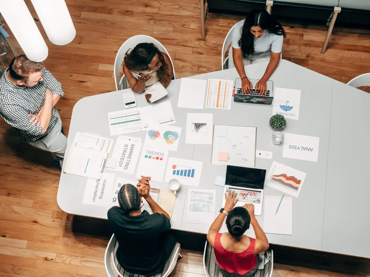 marketing meeting with people collaborating around a table