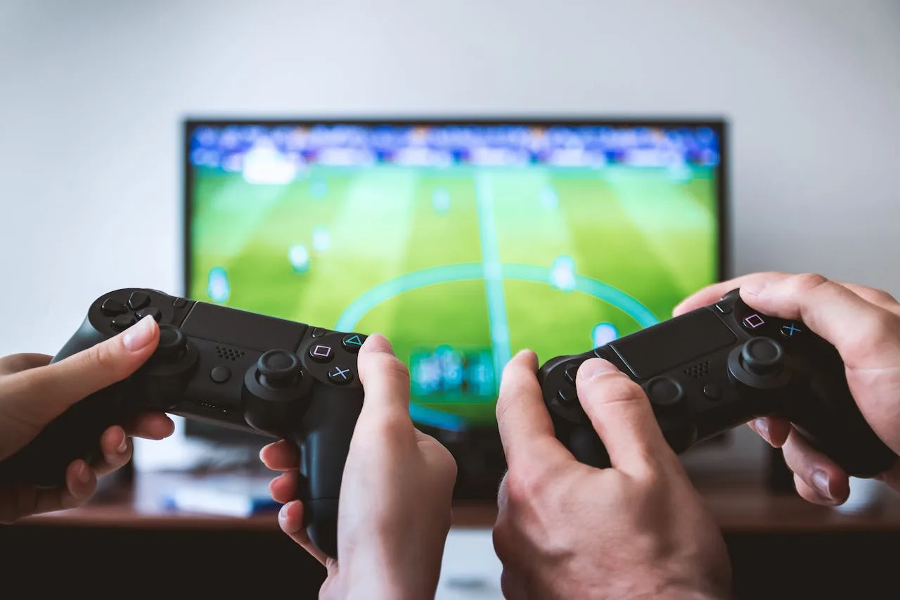 playstation controller used to play a soccer video game
