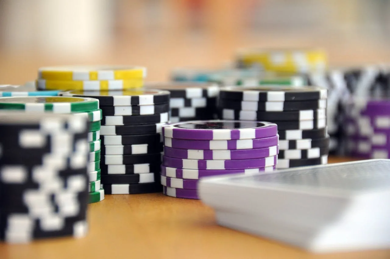 stack of red and white poker chips for casino games