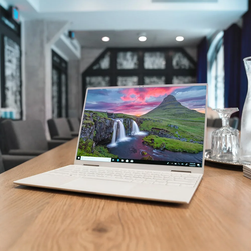 remote worker typing on a laptop in a home office setting
