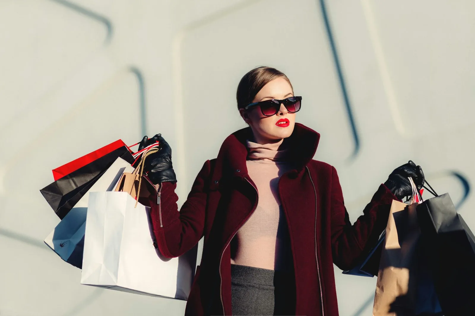 woman happily shopping for clothes in a boutique store