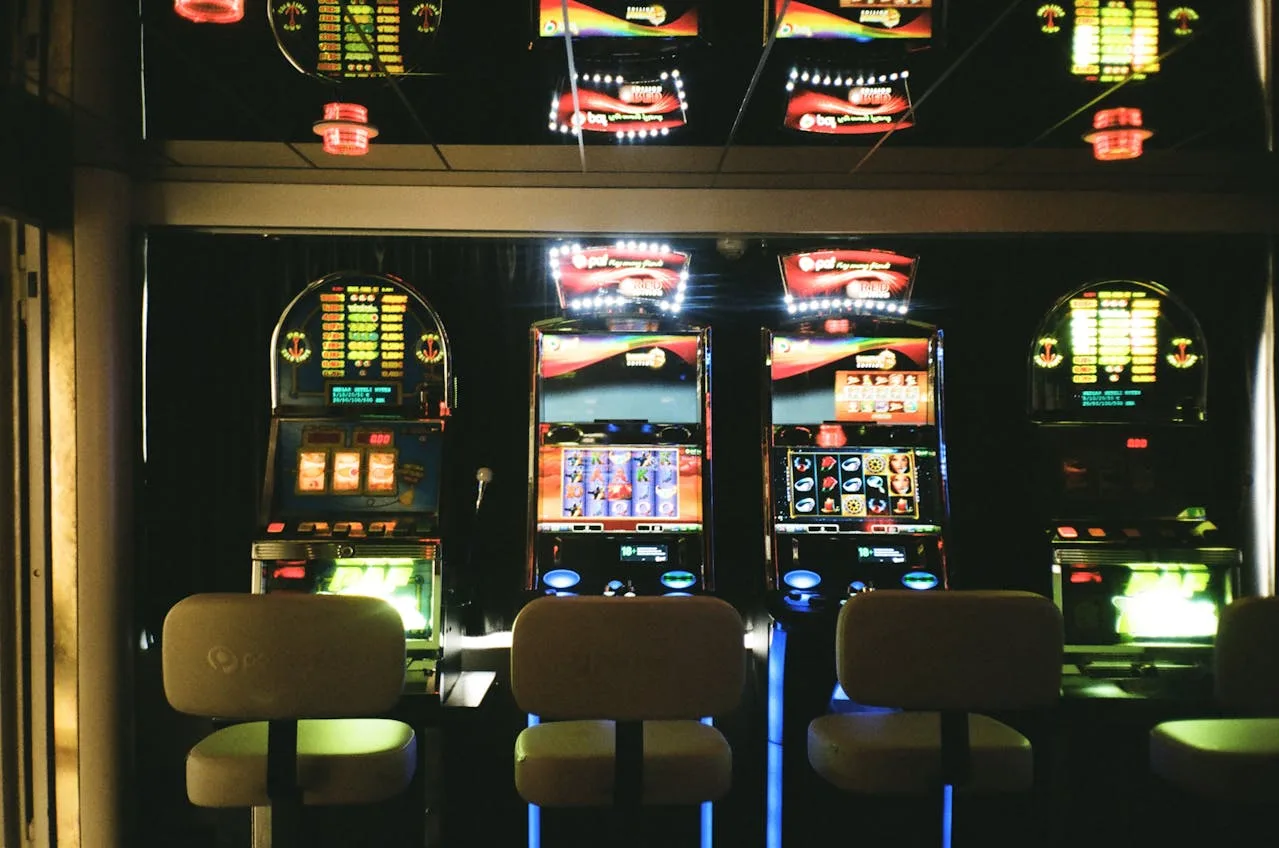 slot machines in a casino with bright lights and colorful displays