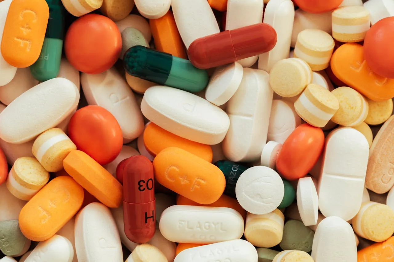 various supplement pills in a white bowl for health and wellness