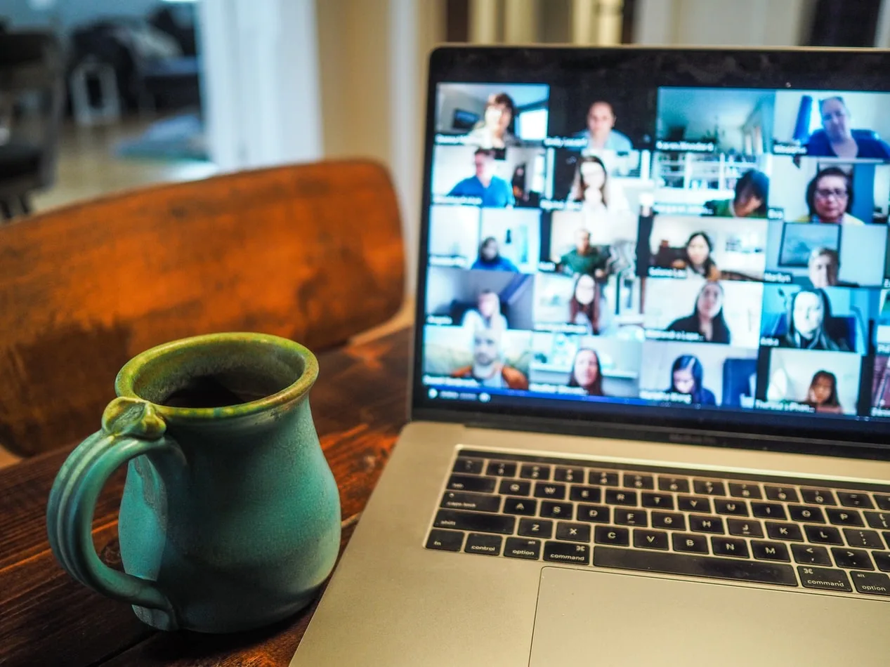 people attending a virtual event on their laptops