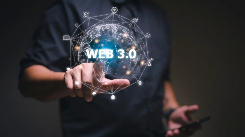 web3 concept image of a man using a laptop for the metaverse