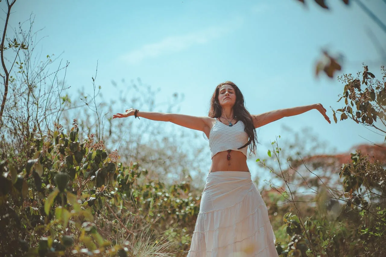 calm woman meditating outdoors at a peaceful wellness retreat