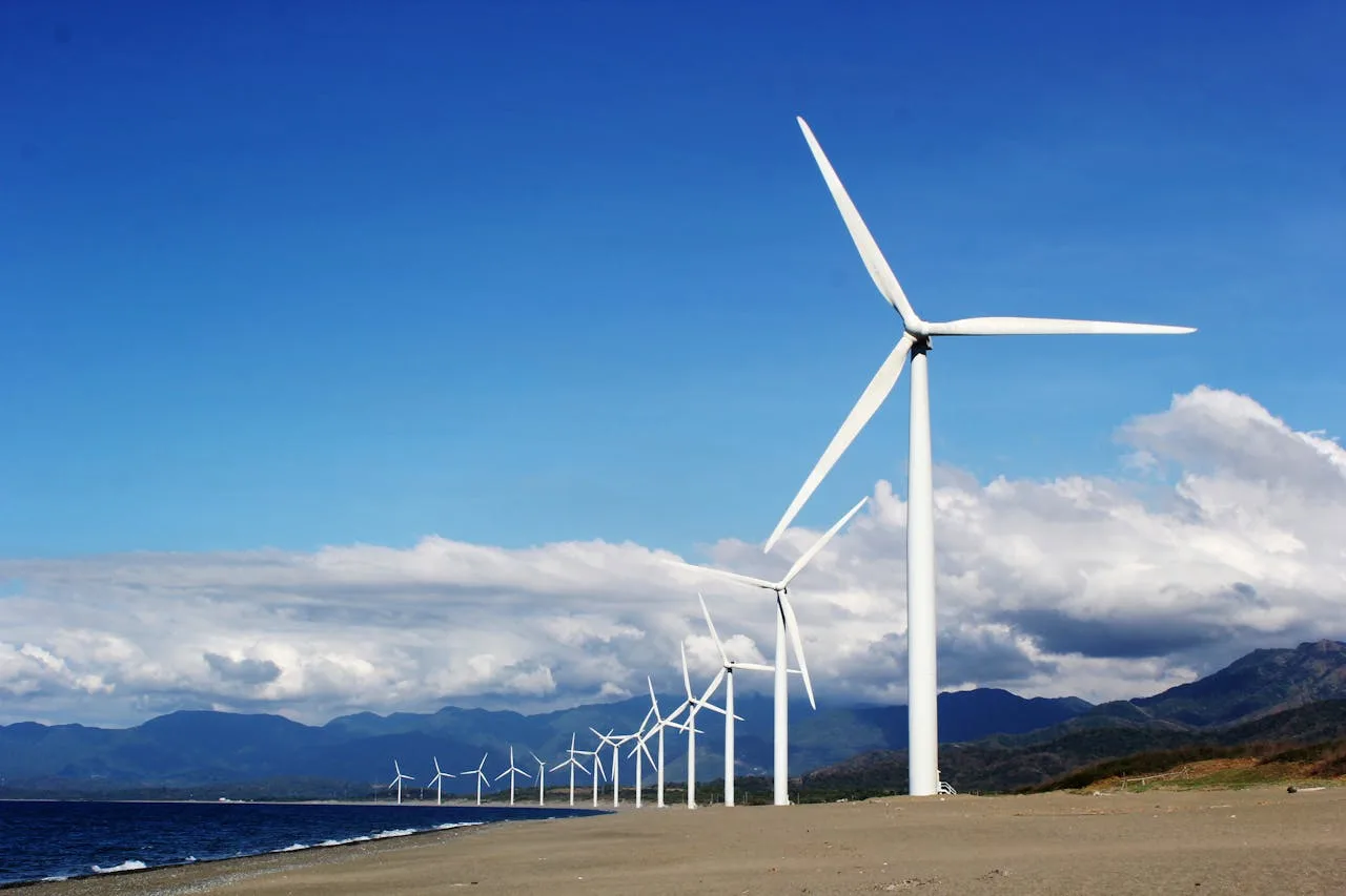 wind farm with turbines by the water